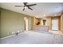 Open living area with kitchen views and access to other rooms at 19539 N 260Th Ln, Buckeye, AZ 85396