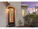 Elegant front entrance with a stained-glass door and exterior lighting at 22454 N San Ramon Dr, Sun City West, AZ 85375