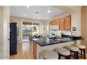 Modern kitchen with granite countertops and stainless steel appliances at 22454 N San Ramon Dr, Sun City West, AZ 85375