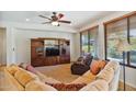 Relaxing living room with built-in entertainment center and comfortable seating at 26335 W Burnett Rd, Buckeye, AZ 85396