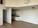 Kitchen with white cabinets, dark countertops, and an electric stove at 3120 N 67Th Ln # 42, Phoenix, AZ 85033