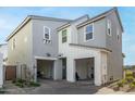 Two-story home with gray siding, white accents, and a two-car garage at 4746 S Ferric --, Mesa, AZ 85212