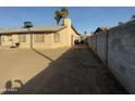 Large backyard with a block wall and sparse vegetation at 4830 S 22Nd Pl, Phoenix, AZ 85040