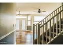 Bright entryway with tile flooring and staircase at 7 N 87Th Dr, Tolleson, AZ 85353