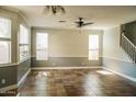 Spacious living room with tile floors and neutral walls at 7 N 87Th Dr, Tolleson, AZ 85353