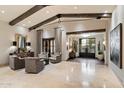 Spacious living room with high ceilings, exposed beams, and comfortable seating at 8124 E Paraiso Dr, Scottsdale, AZ 85255