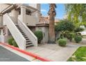 Staircase leading to condo building entrance at 1211 N Miller Rd # 201, Scottsdale, AZ 85257