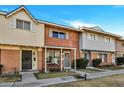 Attractive townhome with brick exterior and well-maintained landscaping at 1387 N 44Th St, Phoenix, AZ 85008