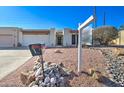 House exterior with a rock garden and a mailbox at 14228 N Yerba Buena Way, Fountain Hills, AZ 85268