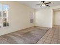 Spacious living room with tile floors and neutral wall colors at 16148 W Starlight Dr, Surprise, AZ 85374