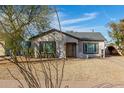 Cozy home exterior with desert landscaping offering Southwest charm and curb appeal at 1934 E Brill St, Phoenix, AZ 85006