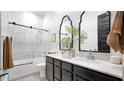 Elegant bathroom with double vanity and a walk-in shower at 23776 N 167Th Ln, Surprise, AZ 85387