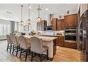 Modern kitchen with stainless steel appliances and an island at 26019 W Ponderosa Ln, Buckeye, AZ 85396