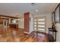 Bright and airy entryway with hardwood floors and a modern front door at 2645 E Glenrosa Ave, Phoenix, AZ 85016