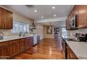 Open concept kitchen with hardwood floors and stainless steel appliances at 2645 E Glenrosa Ave, Phoenix, AZ 85016