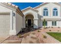 Front entrance with walkway leading to a dark gray door at 3258 E Dover St, Mesa, AZ 85213