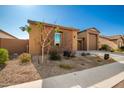 Well-maintained one-story home with a two-car garage and mature trees at 3923 W Hayduk Rd, Laveen, AZ 85339