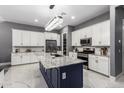 Gourmet kitchen boasts a large island and stainless steel appliances at 3923 W Hayduk Rd, Laveen, AZ 85339