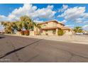 Two-story house on a residential street with a gravel front yard at 5766 W Brown St, Glendale, AZ 85302