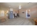 Open dining area with wood floors and kitchen access at 6210 N Poplar St, Maricopa, AZ 85139