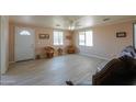 Bright living room featuring tile floors and comfy seating at 6210 N Poplar St, Maricopa, AZ 85139