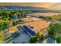 Aerial view of a ranch home with expansive grounds and mountain views at 6212 S 37Th St, Phoenix, AZ 85042