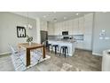 Modern kitchen with granite countertops and an island, adjacent to a dining area at 6301 N 12Th St # 8, Phoenix, AZ 85014