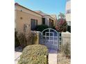 Private gated entrance with lush landscaping at 7740 E Gainey Ranch Rd # 13, Scottsdale, AZ 85258