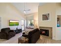 Living room with fireplace, large TV, and window seat at 9708 E Via Linda -- # 2313, Scottsdale, AZ 85258