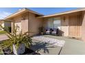 Inviting front porch with seating area and landscaping at 9920 W Shasta Dr, Sun City, AZ 85351