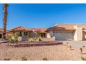 Well-maintained home with tile roof, mature landscaping, and a two-car garage at 10662 N 33Rd Pl, Phoenix, AZ 85028