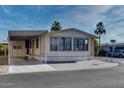 Front view of a manufactured home with carport at 17200 W Bell Rd # 1581, Surprise, AZ 85374