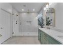 Spa-like bathroom with a large shower and a modern vanity at 17574 W Cardinal Dr, Goodyear, AZ 85338