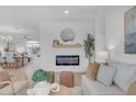 Living room with fireplace, neutral decor, and natural light at 17574 W Cardinal Dr, Goodyear, AZ 85338