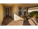 Front entry with two chairs and view of front door at 17848 E Stocking Trl, Rio Verde, AZ 85263