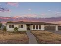 Charming home exterior with a well-maintained yard at sunset at 2037 E Riviera Dr, Tempe, AZ 85282