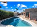 Inviting kidney-shaped pool in a sunny backyard at 2235 N 12Th St, Phoenix, AZ 85006