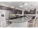 Modern kitchen with granite countertops and stainless steel appliances at 22860 S 226Th St, Queen Creek, AZ 85142