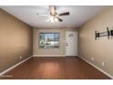 Living room with laminate wood floors and ceiling fan at 2331 W Onza Ave, Mesa, AZ 85202