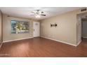 Living room featuring laminate floors and a ceiling fan at 2331 W Onza Ave, Mesa, AZ 85202