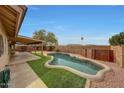 Inviting kidney shaped pool with grassy backyard at 23404 N 45Th Ave, Glendale, AZ 85310