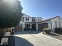 Two-story home with attached garage and landscaping at 2901 E Iris Dr, Chandler, AZ 85286