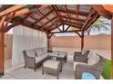 A view inside the backyard gazebo with outdoor seating and lighting at 35598 N Murray Grey Dr, San Tan Valley, AZ 85143