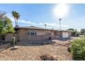 Ranch style home with a spacious yard and desert landscaping at 4511 W Sandra Ter, Glendale, AZ 85306