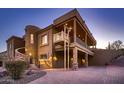 Home features a three-car garage lift, and a large covered patio at 4590 S Gold Canyon Dr, Gold Canyon, AZ 85118