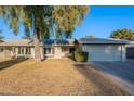 Single-story home with a well-maintained front yard and attached garage at 4914 E Lake Point Cir, Phoenix, AZ 85044
