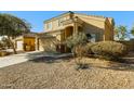 House exterior with driveway, landscaping, and a two-car garage at 5866 S 237Th Ln, Buckeye, AZ 85326