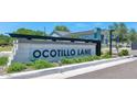 Street view of the Ocotillo Lane neighborhood entrance featuring attractive monument signage and landscaping at 6727 N 9Th Dr, Phoenix, AZ 85013