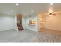 Spacious living room with tile floors and kitchen bar at 8446 N 34Th Dr, Phoenix, AZ 85051