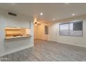 Bright living room with tile floors and kitchen bar at 8446 N 34Th Dr, Phoenix, AZ 85051